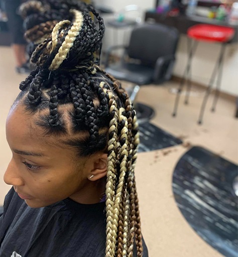 Beautiful blonde and black box braids with high bun