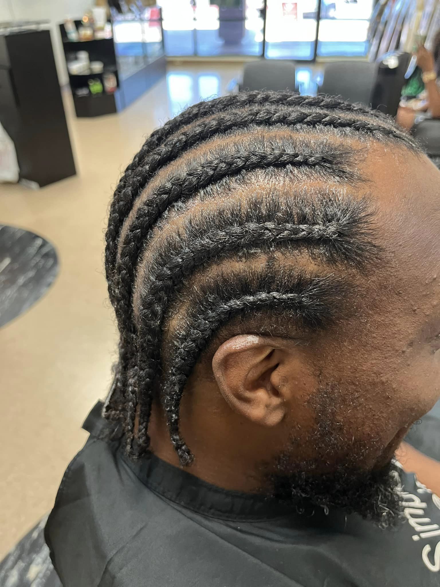 Side view of curved cornrow pattern