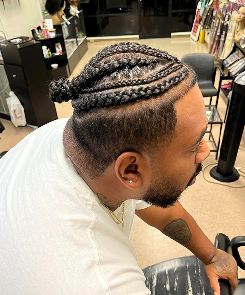 Intricate cornrow braids with fade