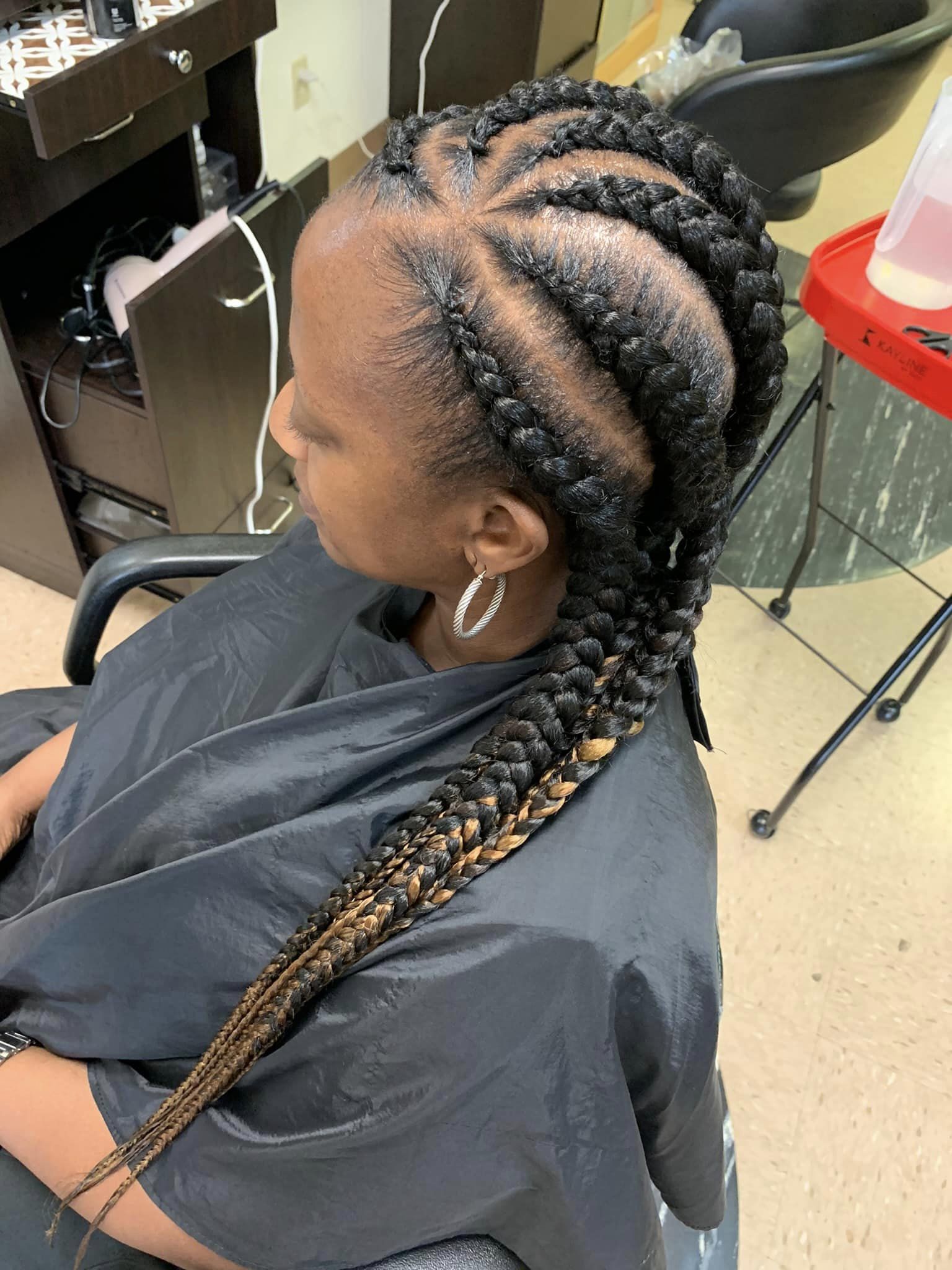 Feed-in cornrows with intricate patterns
