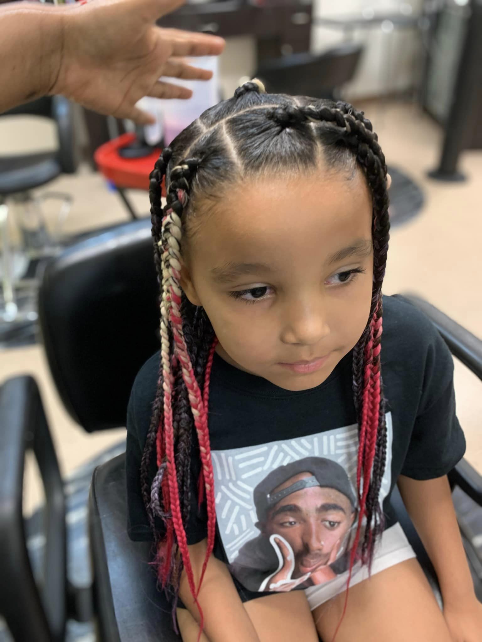 Pink and black box braids on young client